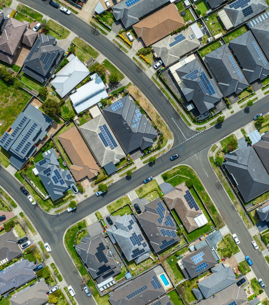 Aerial view of a suburban neighbourhood with rooftop solar panels